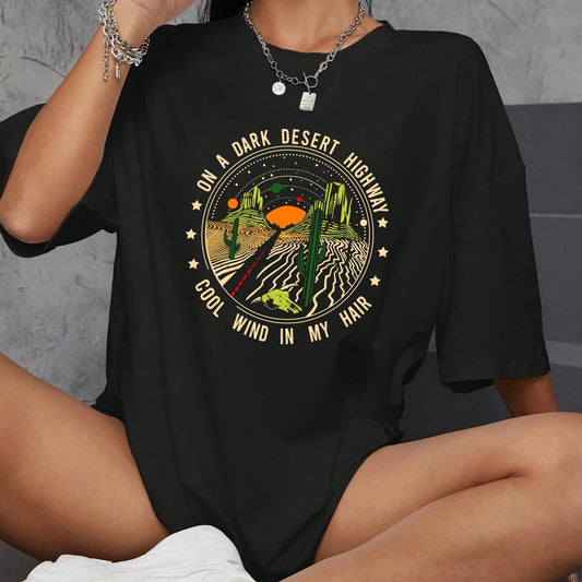 Person wearing a black t-shirt with a graphic design and text.