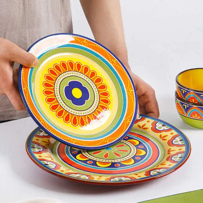 Colorful ceramic plates with intricate designs on a wooden surface.