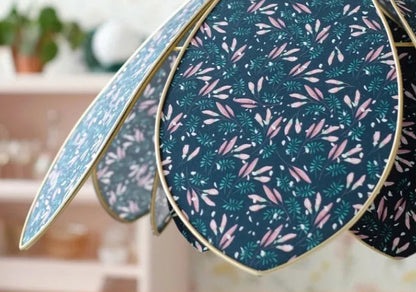 Decorative fabric panels with floral pattern on a blurred indoor background