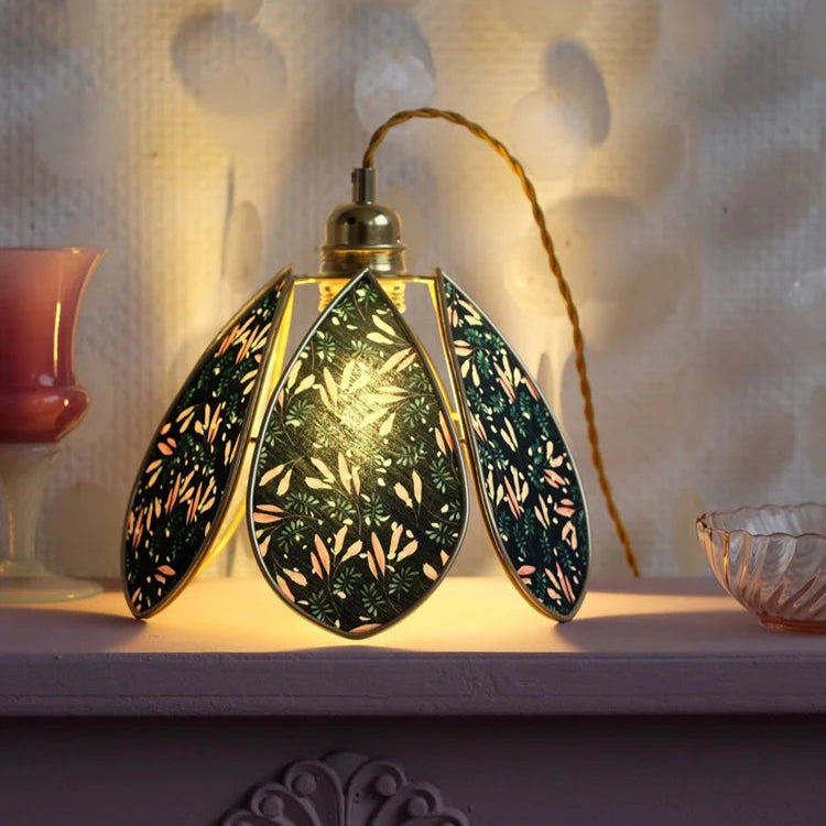 Decorative lamp with intricate design on a textured surface